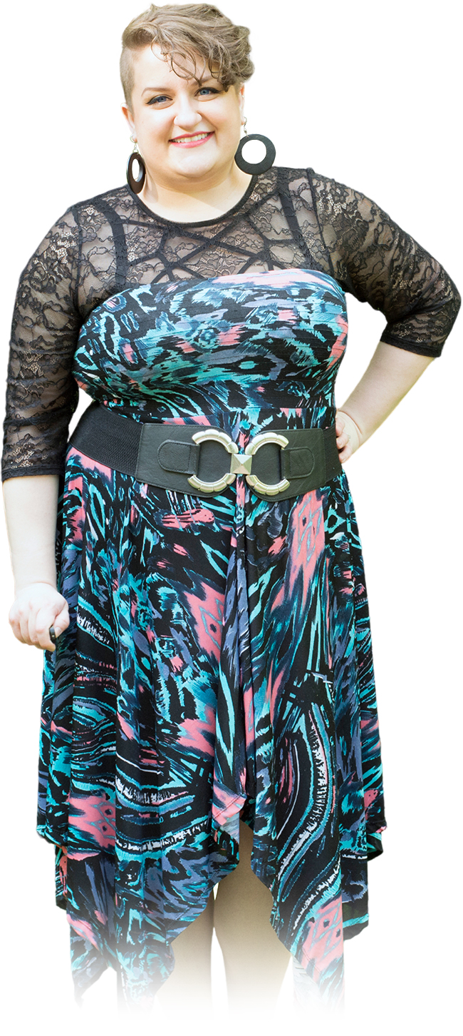 an image of Jessika Clarke standing in black dress with colourful blotches