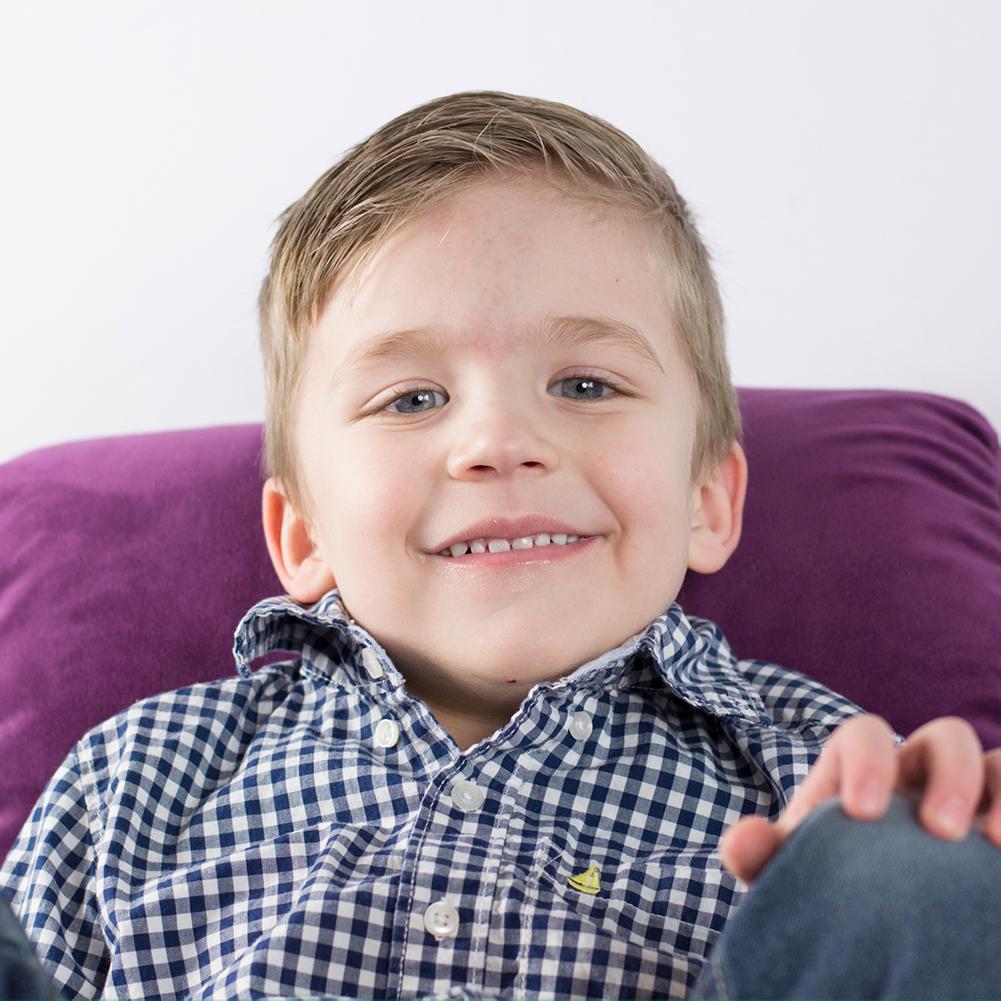 Photo of boy in chair by Jessika Digital